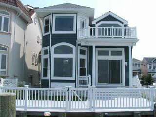 1204 PLEASURE, Ocean City - Single Family - NEWER CONSTRUCTION.  Fully furnished & equipped w/designer decor, move-in complete interior.  Soaring 2-story cathedral ceiling w/2nd floor balcony, lg bi-level bulkhead deck w/(2) deep water boat slips, 2nd floor bayfront master suite w/gas fpl, tile/hardwd/granite/marble & stainlss steel.  Unique floor plan w/AWESOME OPEN BAY VIEWS throughout, experience this wonderful bayfront setting!